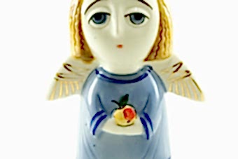 статуэтка-ангел-с-яблоком